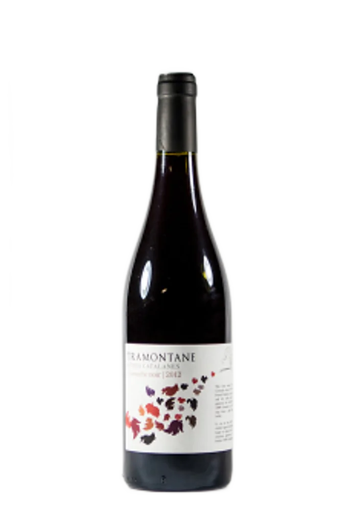 Bottle of Tramontane Grenache Noir red wine, white label with red and purple leaves.