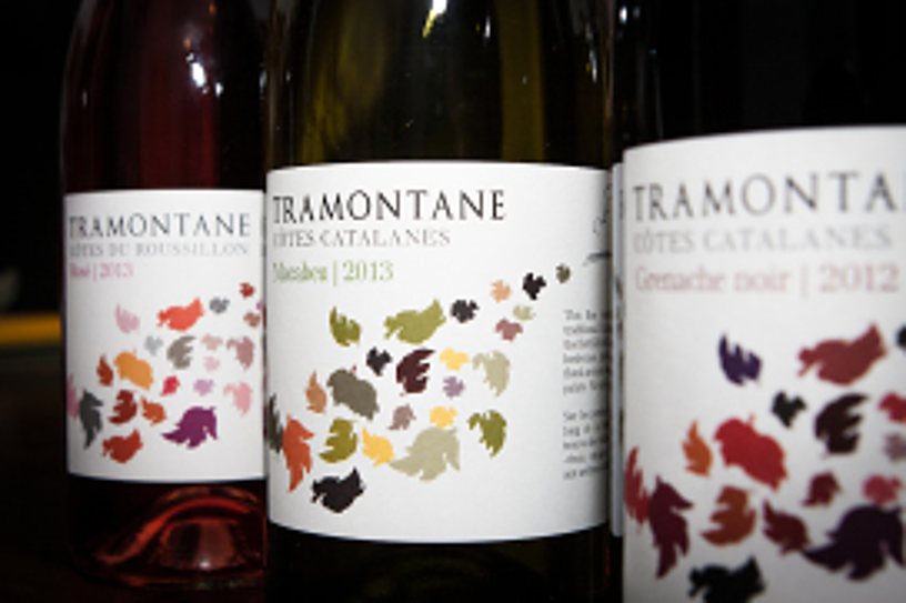 Three bottles of Tramontane wine from the Côtes Catalanes with labels decorated with coloured leaves.